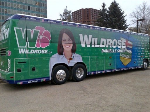 Political Candidate Wildrose Bus Paintjob. Wheels where her chest is. 